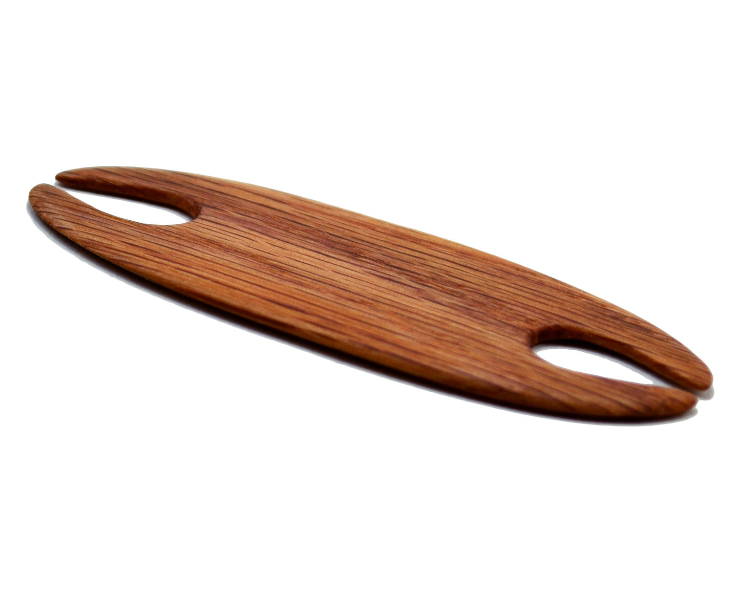 Small weaving shuttle. Handcrafted from red oak by Wiener Dog Ranch.