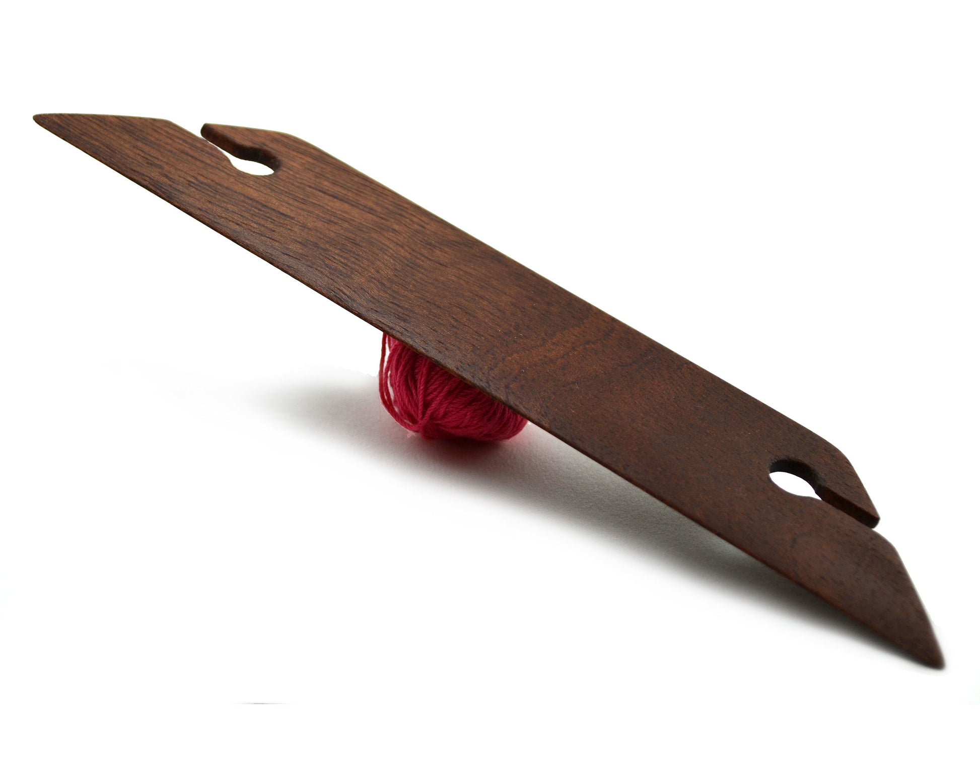 8 inch beveled weaving shuttle. Handcrafted from mahogany by Wiener Dog Ranch. Front.