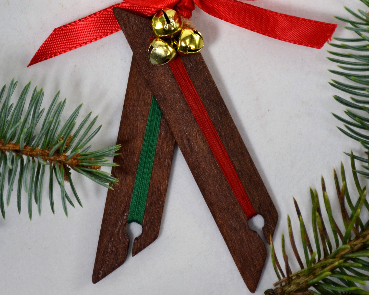 Weaving shuttle Christmas ornament. Handcrafted from mahogany by Wiener Dog Ranch.