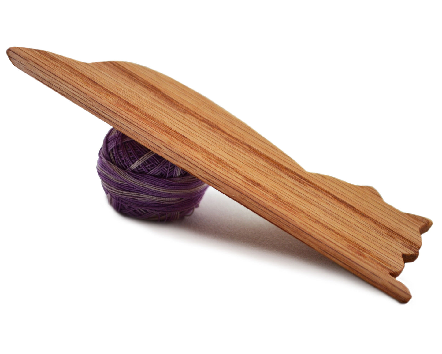 Cat beveled weaving shuttle. Handcrafted from red oak by Wiener Dog Ranch.